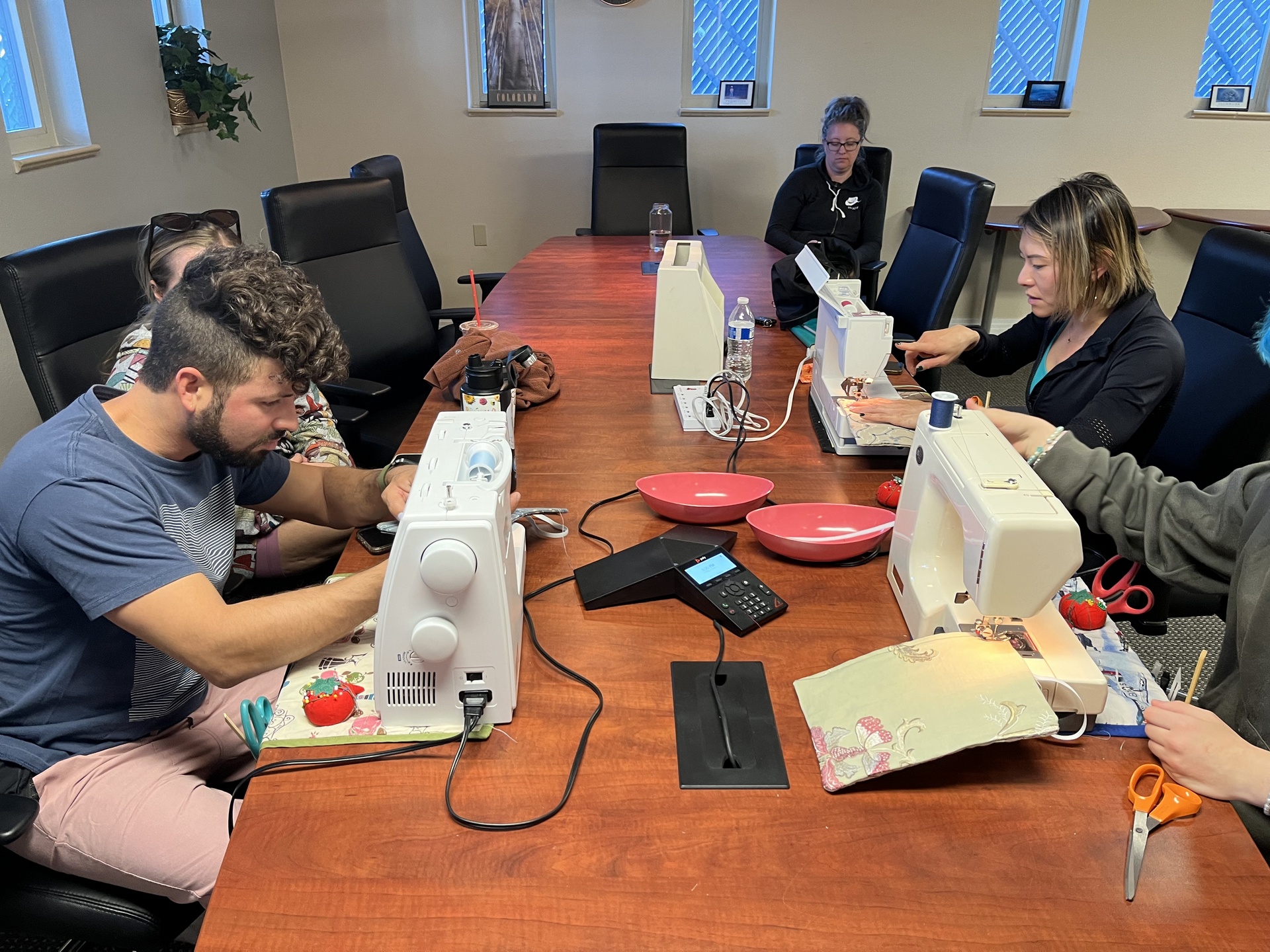 students learning to sew